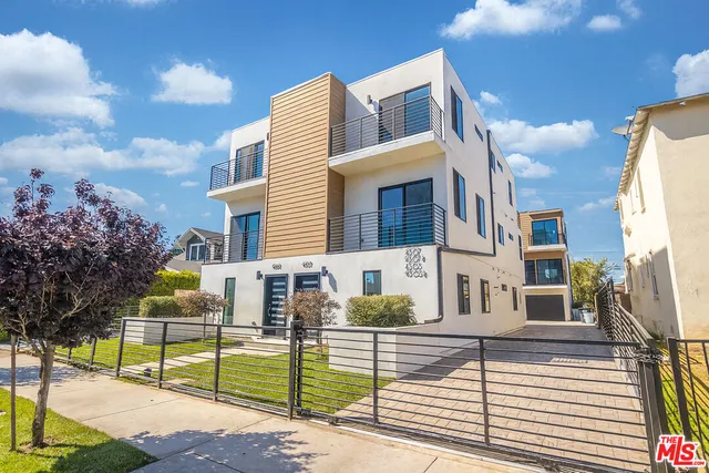 a view of a brick building with many windows