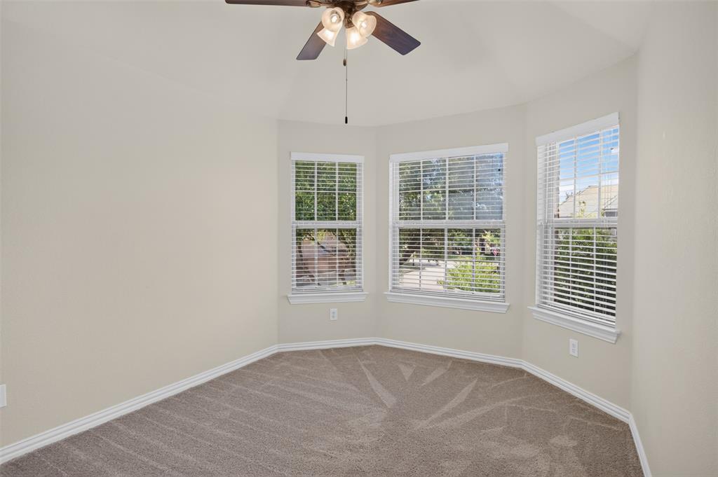 842 Sun Meadow Road Allen, TX 75013 - Photo 28 of 39 Carpeted room featuring a bay window with three double-hung windows, each equipped with white blinds