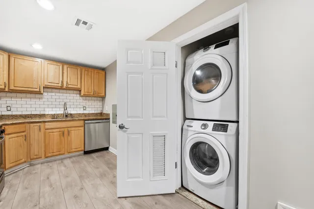 a view of a kitchen with washer and dryer