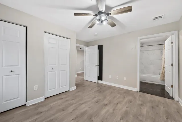 a view of an empty room with a bathroom