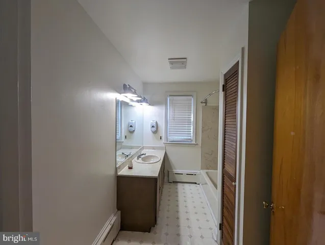 a view of a hallway with washer and dryer