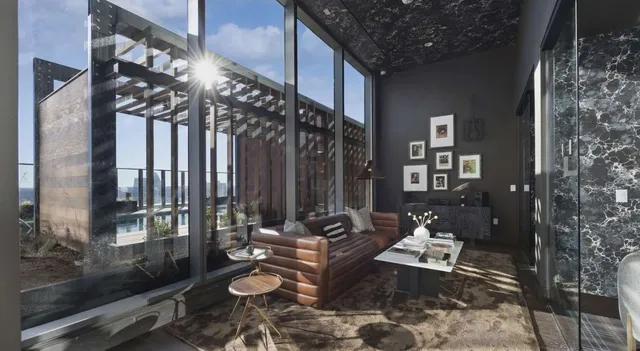 a living room with furniture and a floor to ceiling window