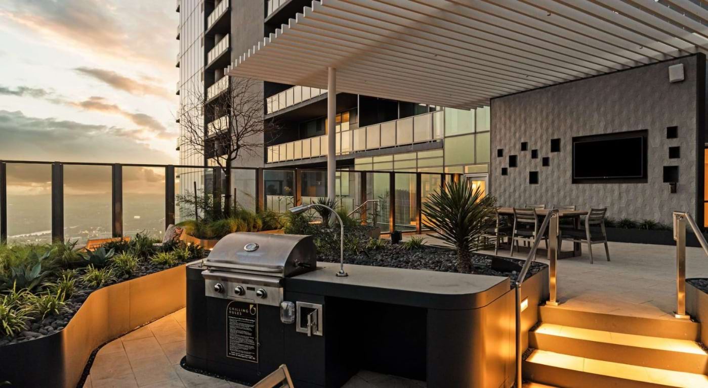 600 Guadalupe Street, Unit 5807 Austin, TX 78701 - Photo 21 of 28 a view of a patio with table and chairs potted plants with wooden roof and floor