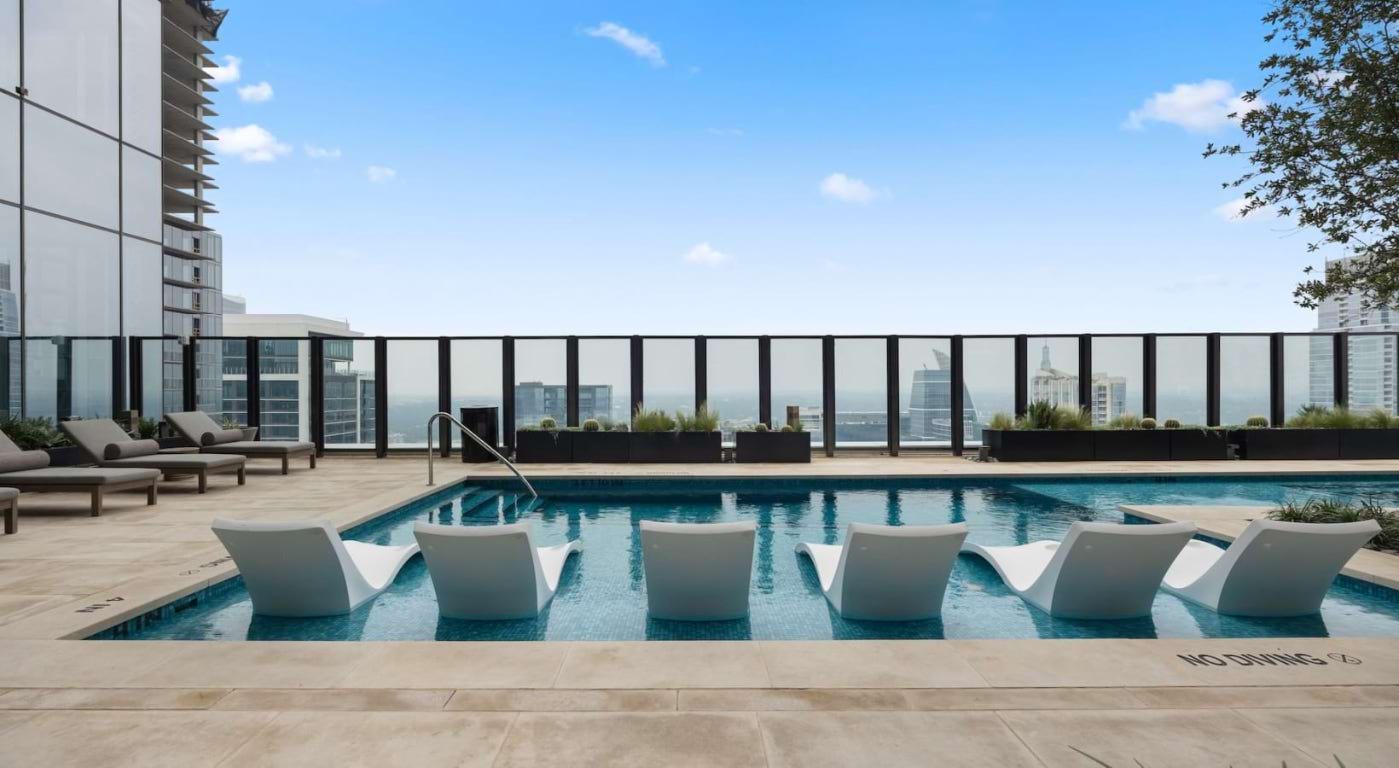 600 Guadalupe Street, Unit 5807 Austin, TX 78701 - Photo 9 of 28 a view of a swimming pool with outdoor seating