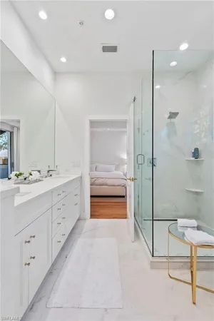 a bedroom with a bed and flat tv