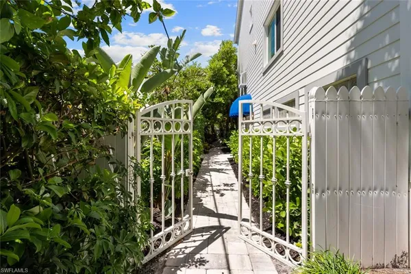 a view of small garden in the backyard of a house
