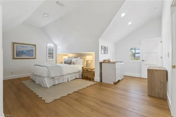 a en suite bathroom with a sink mirror and tub