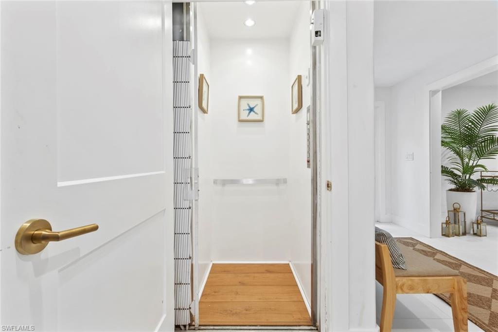 888 10th Street South, Unit 101 Naples, FL 34102 - Photo 25 of 31 a bathroom with a tub and shower