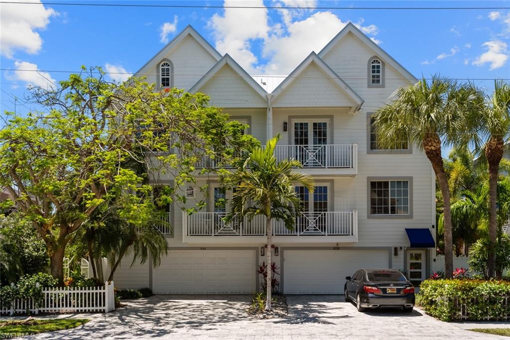 888 10th Street South, Unit 101 Naples, FL 34102 - Photo 31 of 31 a front view of a house with a garden
