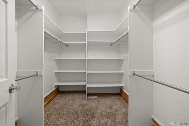 a view of an empty walk in closet