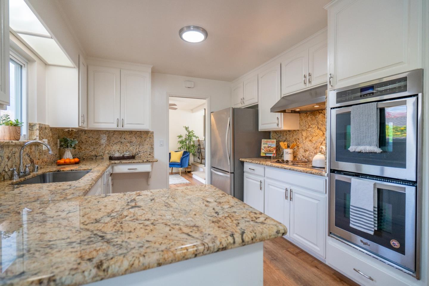 753 Peekskill Drive Sunnyvale, CA 94087 - Photo 13 of 33 a kitchen with stainless steel appliances granite countertop a stove a sink and a refrigerator
