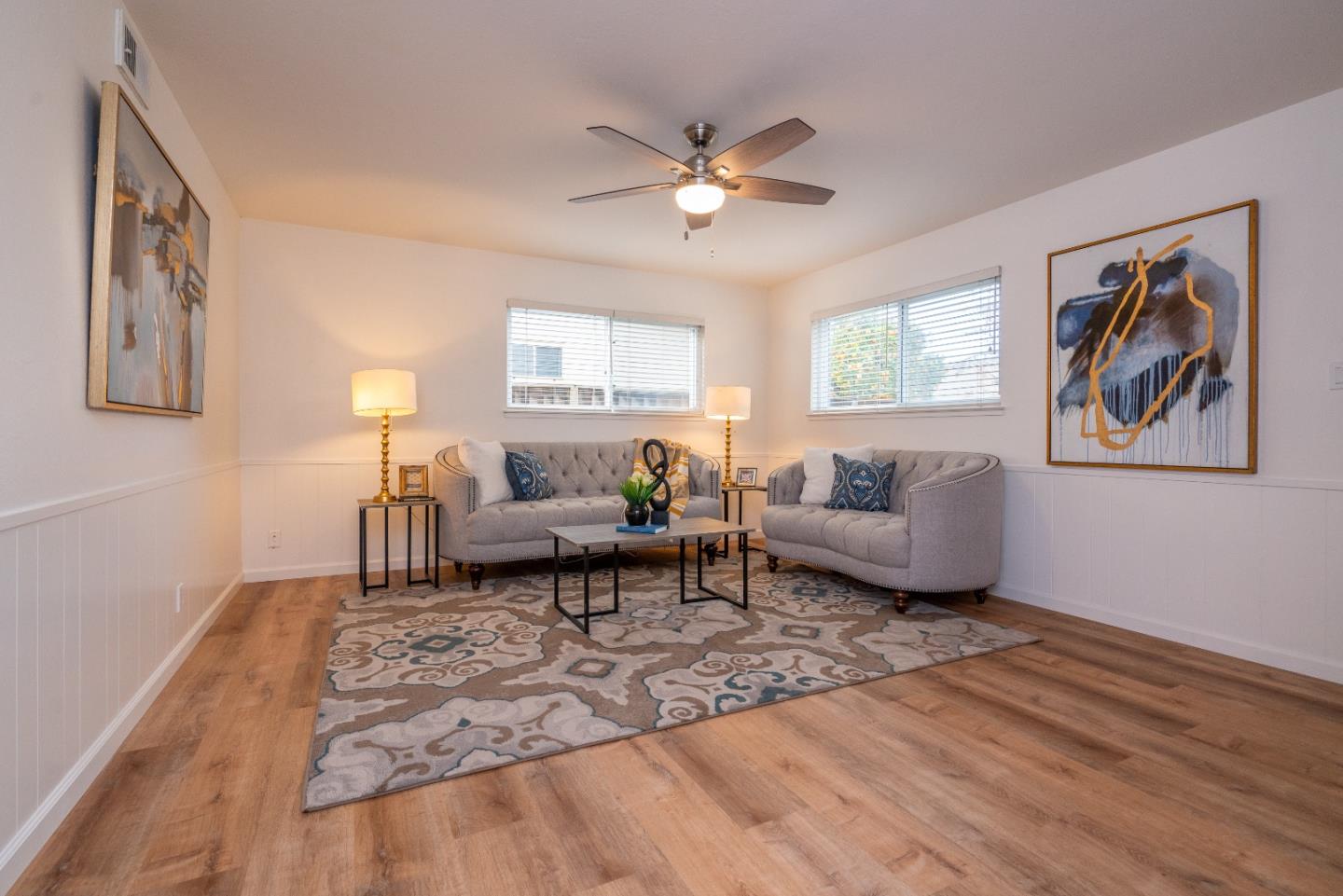 753 Peekskill Drive Sunnyvale, CA 94087 - Photo 19 of 33 a living room with furniture and a chandelier