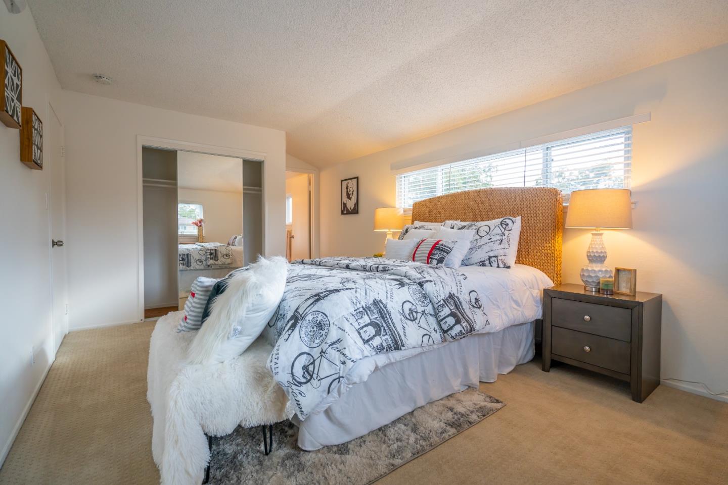 753 Peekskill Drive Sunnyvale, CA 94087 - Photo 21 of 33 a bedroom with a bed and lamp