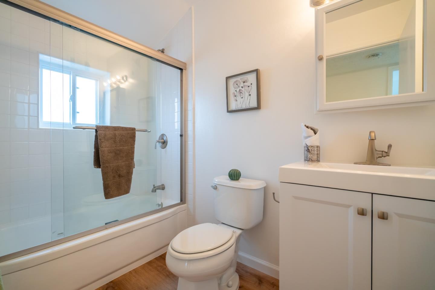 753 Peekskill Drive Sunnyvale, CA 94087 - Photo 25 of 33 a bathroom with a toilet sink and mirror