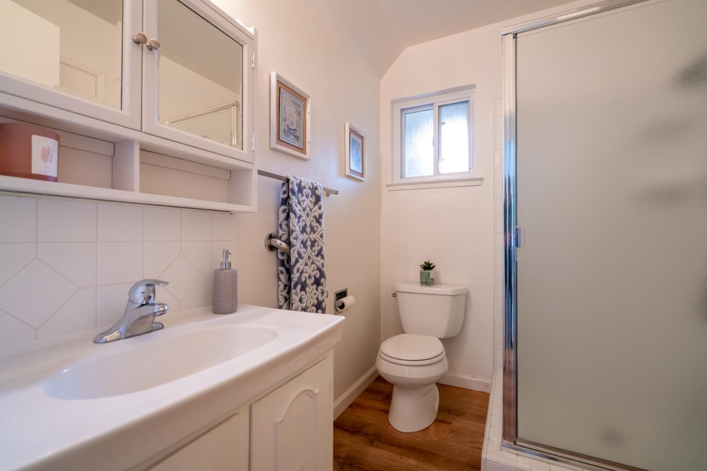 753 Peekskill Drive Sunnyvale, CA 94087 - Photo 28 of 33 a bathroom with a sink toilet and a mirror