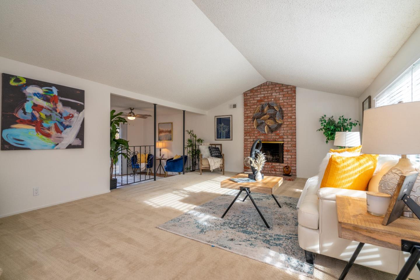 753 Peekskill Drive Sunnyvale, CA 94087 - Photo 9 of 33 a living room with furniture a fireplace and a flat screen tv