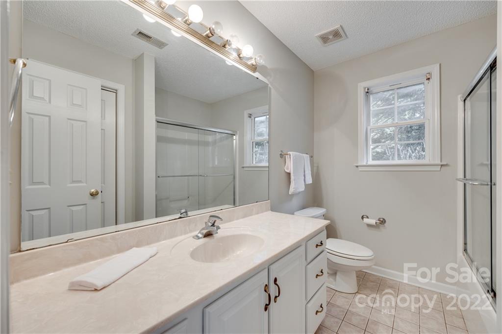 1307 Crown Ridge Drive Fort Mill, SC 29708 - Photo 17 of 24 a bathroom with a toilet sink and mirror