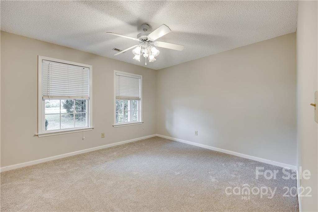 1307 Crown Ridge Drive Fort Mill, SC 29708 - Photo 19 of 24 an empty room with windows and fan