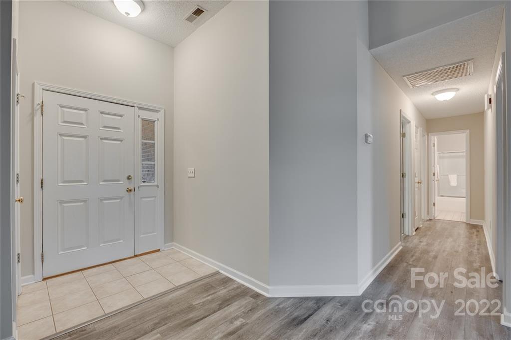 1307 Crown Ridge Drive Fort Mill, SC 29708 - Photo 3 of 24 a view of a hallway with wooden floor
