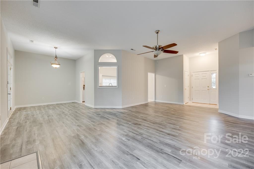 1307 Crown Ridge Drive Fort Mill, SC 29708 - Photo 5 of 24 a view of empty room with wooden floor and fan