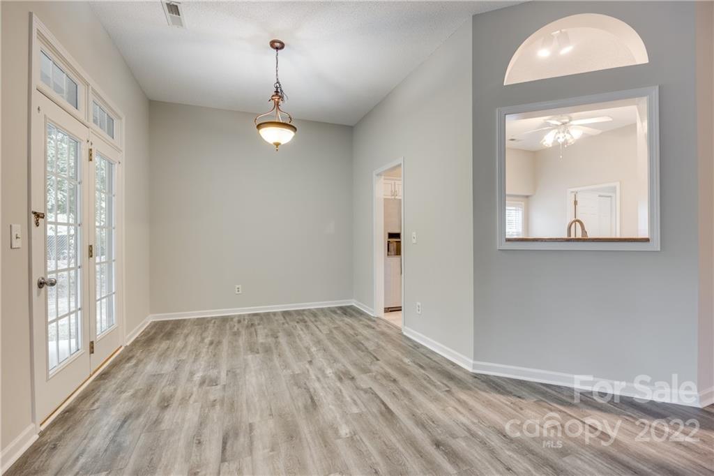 1307 Crown Ridge Drive Fort Mill, SC 29708 - Photo 8 of 24 wooden floor in an empty room with a window