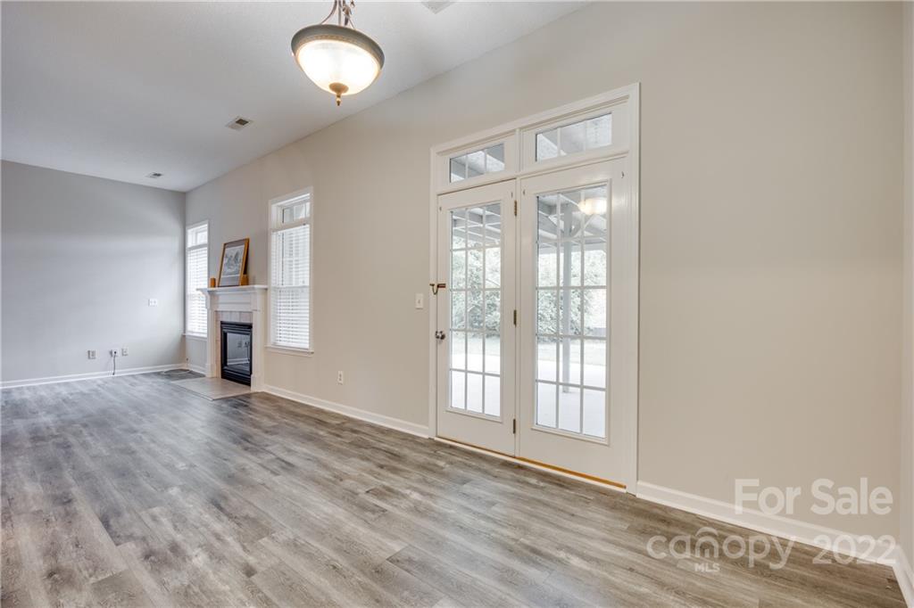1307 Crown Ridge Drive Fort Mill, SC 29708 - Photo 9 of 24 a view of empty room with wooden floor and fan