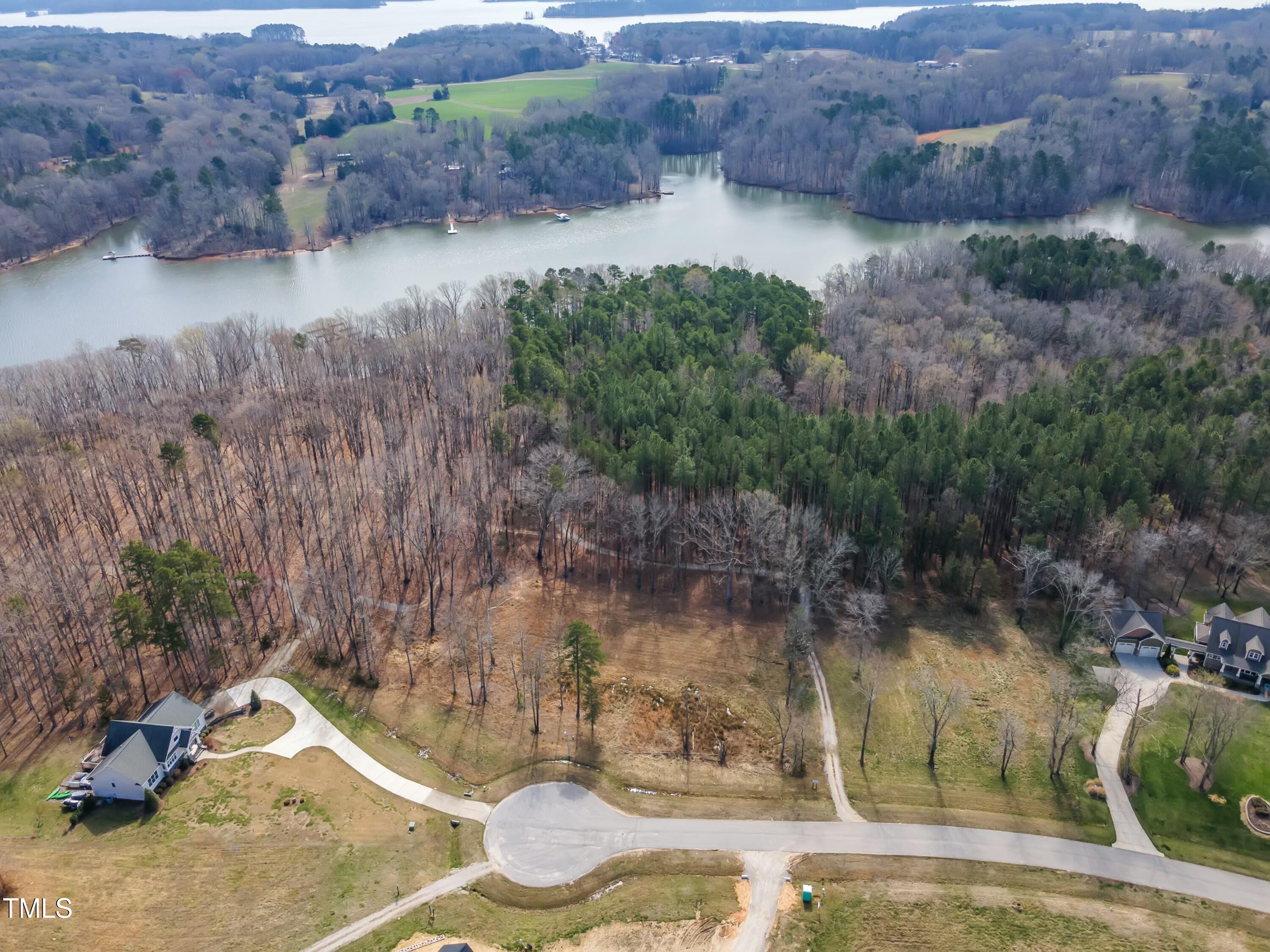 32 Waterstone Lane Henderson, NC 27537 - Photo 15 of 19 a backyard of a house with lots of green space