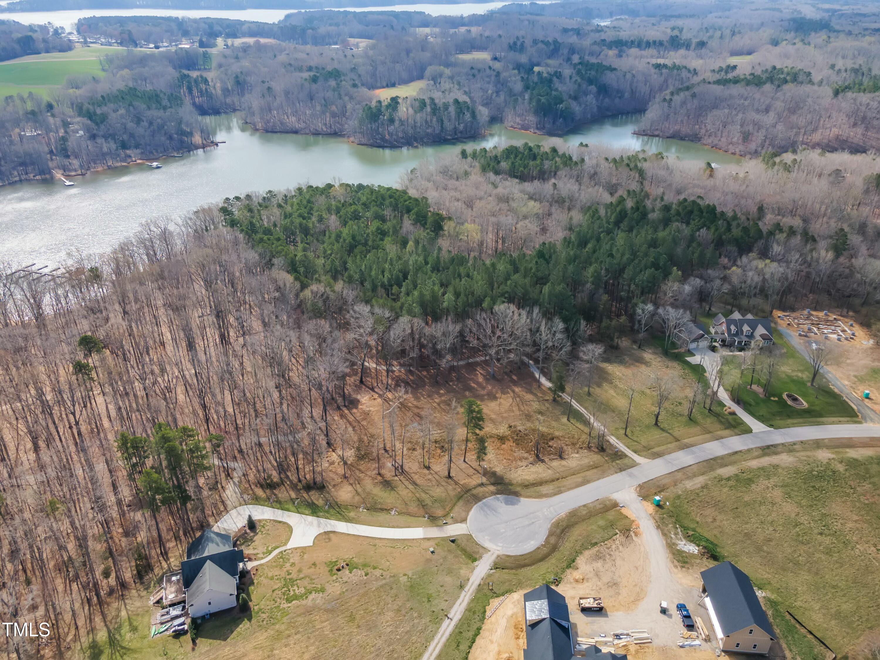 32 Waterstone Lane Henderson, NC 27537 - Photo 7 of 19 a view of a backyard with plants and lake view