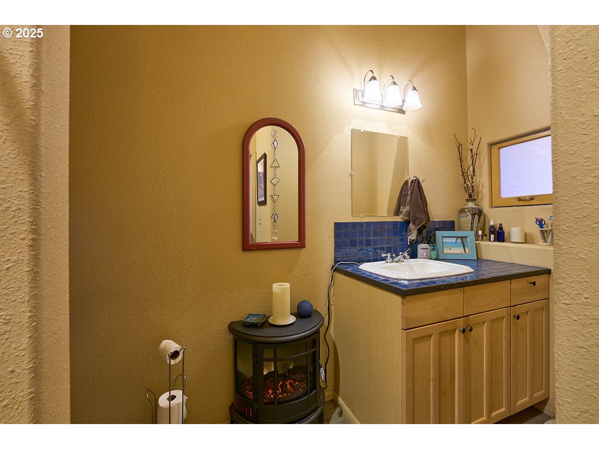 105 East Main Street Enterprise, OR 97828 - Photo 15 of 28 a bathroom with a sink and a mirror
