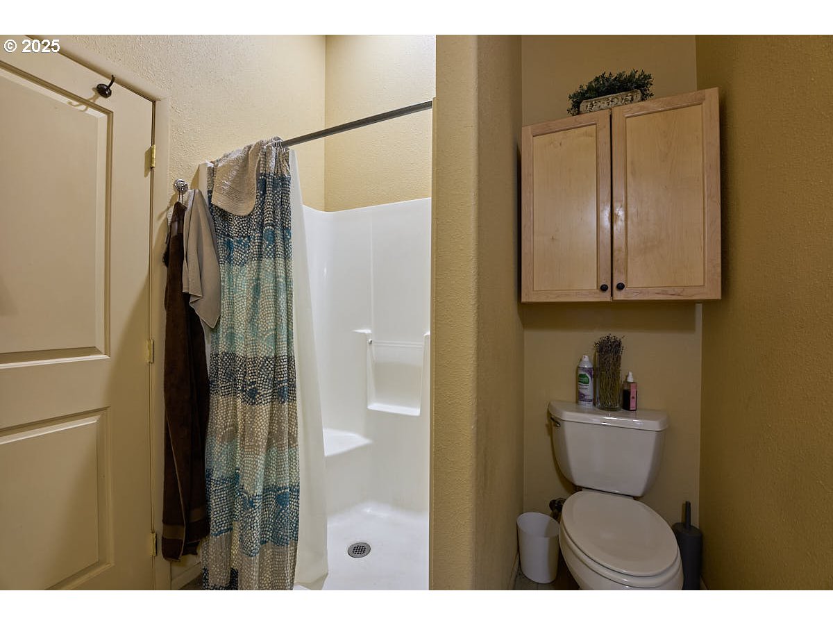 105 East Main Street Enterprise, OR 97828 - Photo 16 of 28 a bathroom with a sink toilet and shower