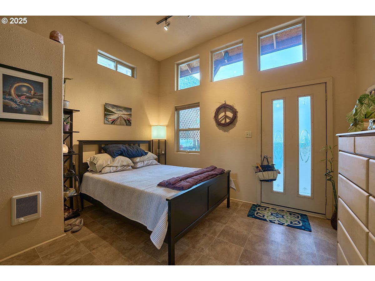 105 East Main Street Enterprise, OR 97828 - Photo 17 of 28 a bedroom with a bed and a view of bathroom