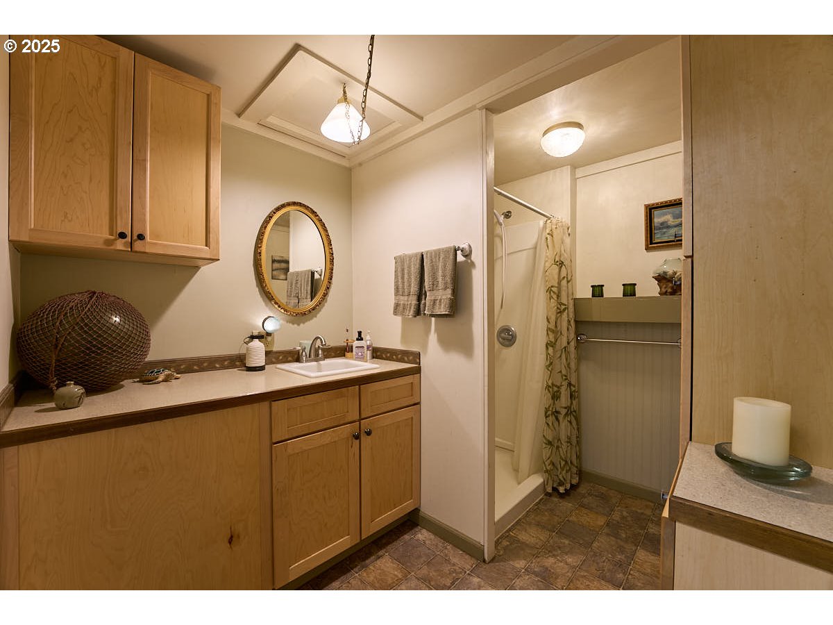 105 East Main Street Enterprise, OR 97828 - Photo 23 of 28 a kitchen with a sink and refrigerator