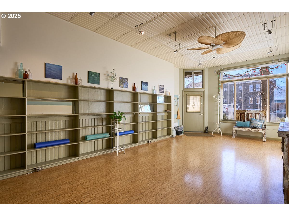 105 East Main Street Enterprise, OR 97828 - Photo 3 of 28 a view of a livingroom with furniture wooden floor and windows