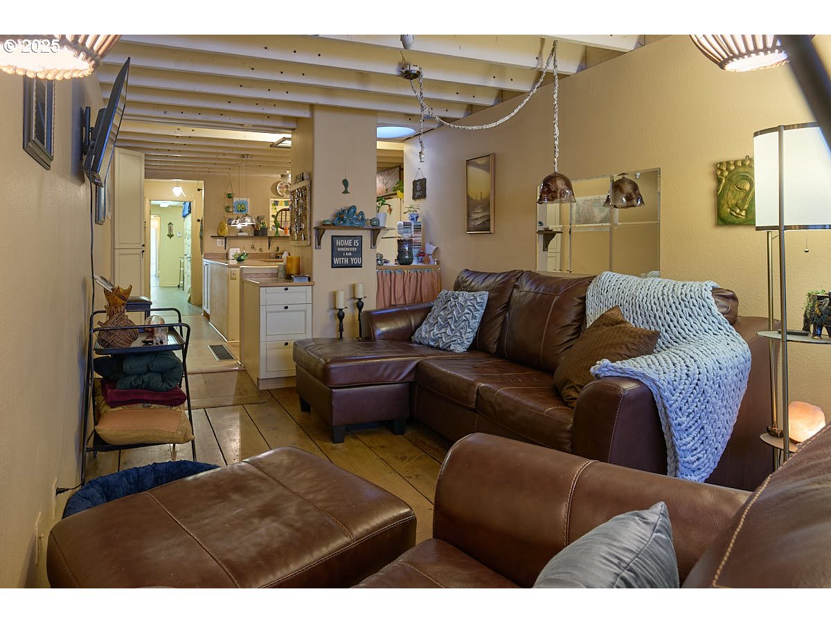 105 East Main Street Enterprise, OR 97828 - Photo 8 of 28 a living room with furniture and a chandelier