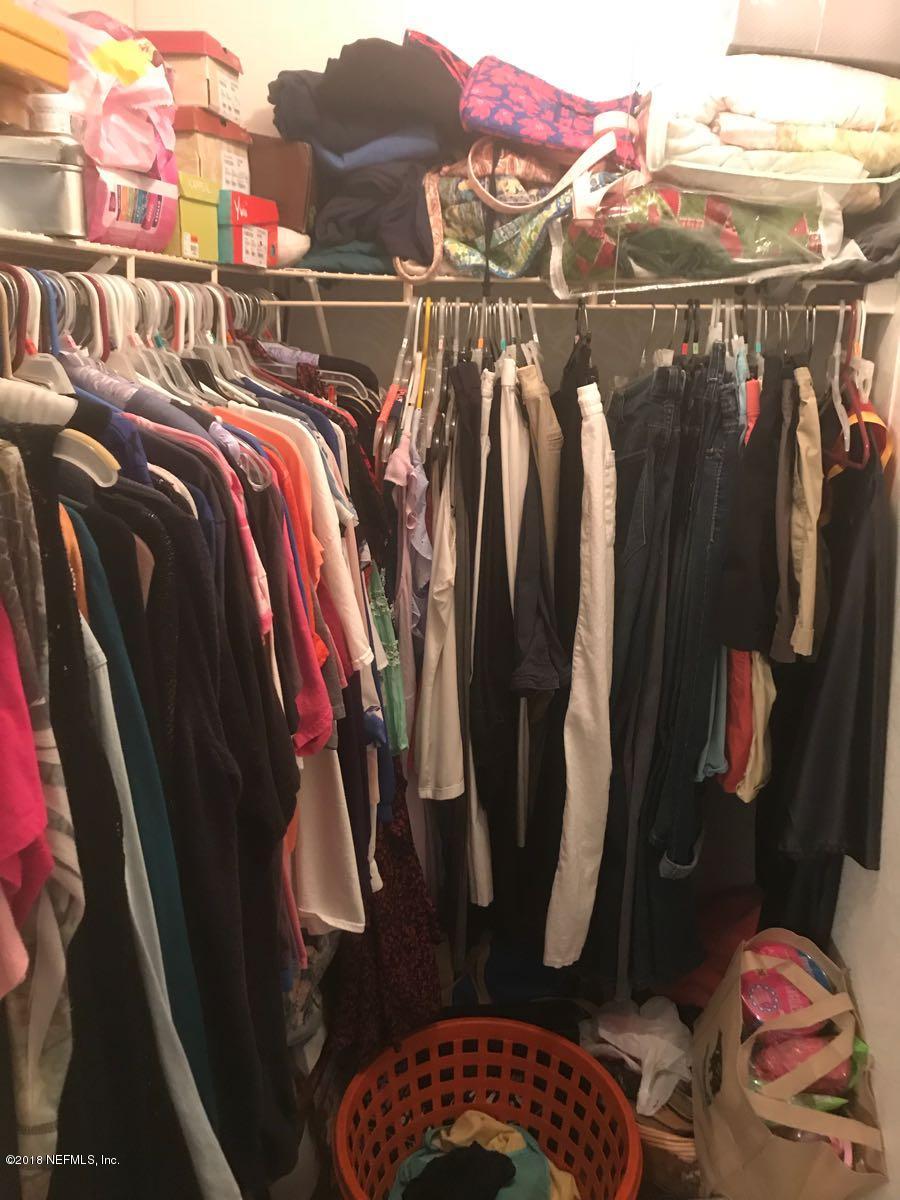 1609 Blair Road Jacksonville, FL 32221 - Photo 16 of 30 a view of walk in closet with clothes and shoes