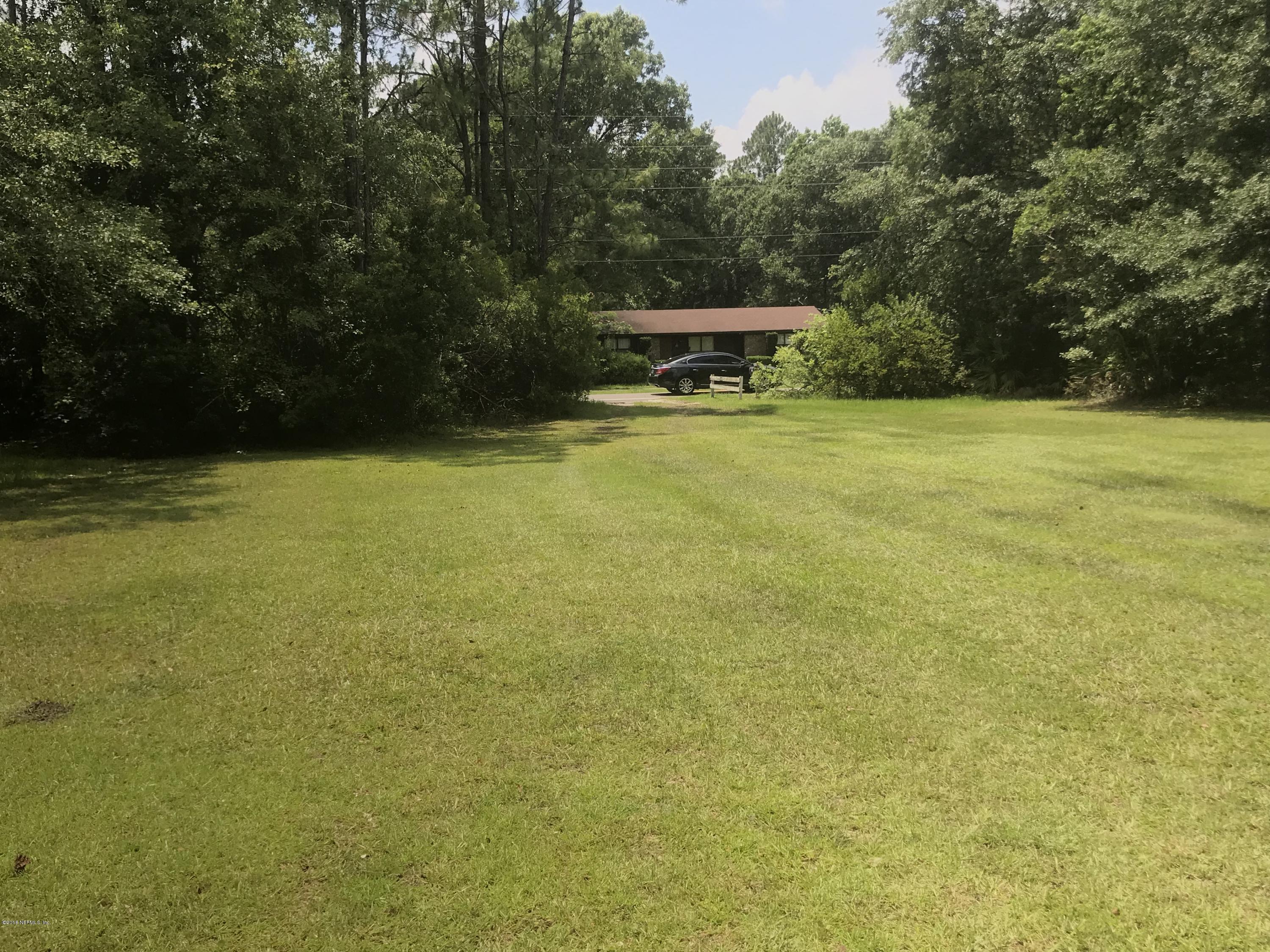 1609 Blair Road Jacksonville, FL 32221 - Photo 24 of 30 a view of a green field with trees