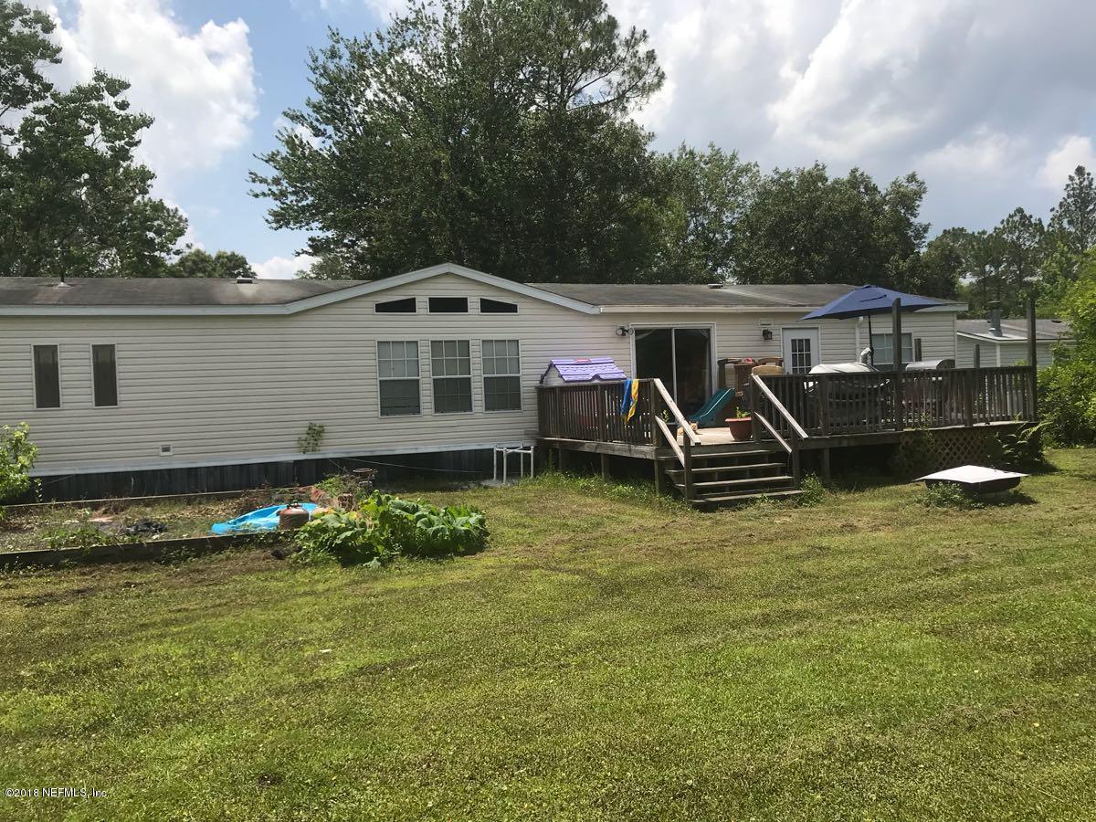 1609 Blair Road Jacksonville, FL 32221 - Photo 27 of 30 a front view of a house with garden