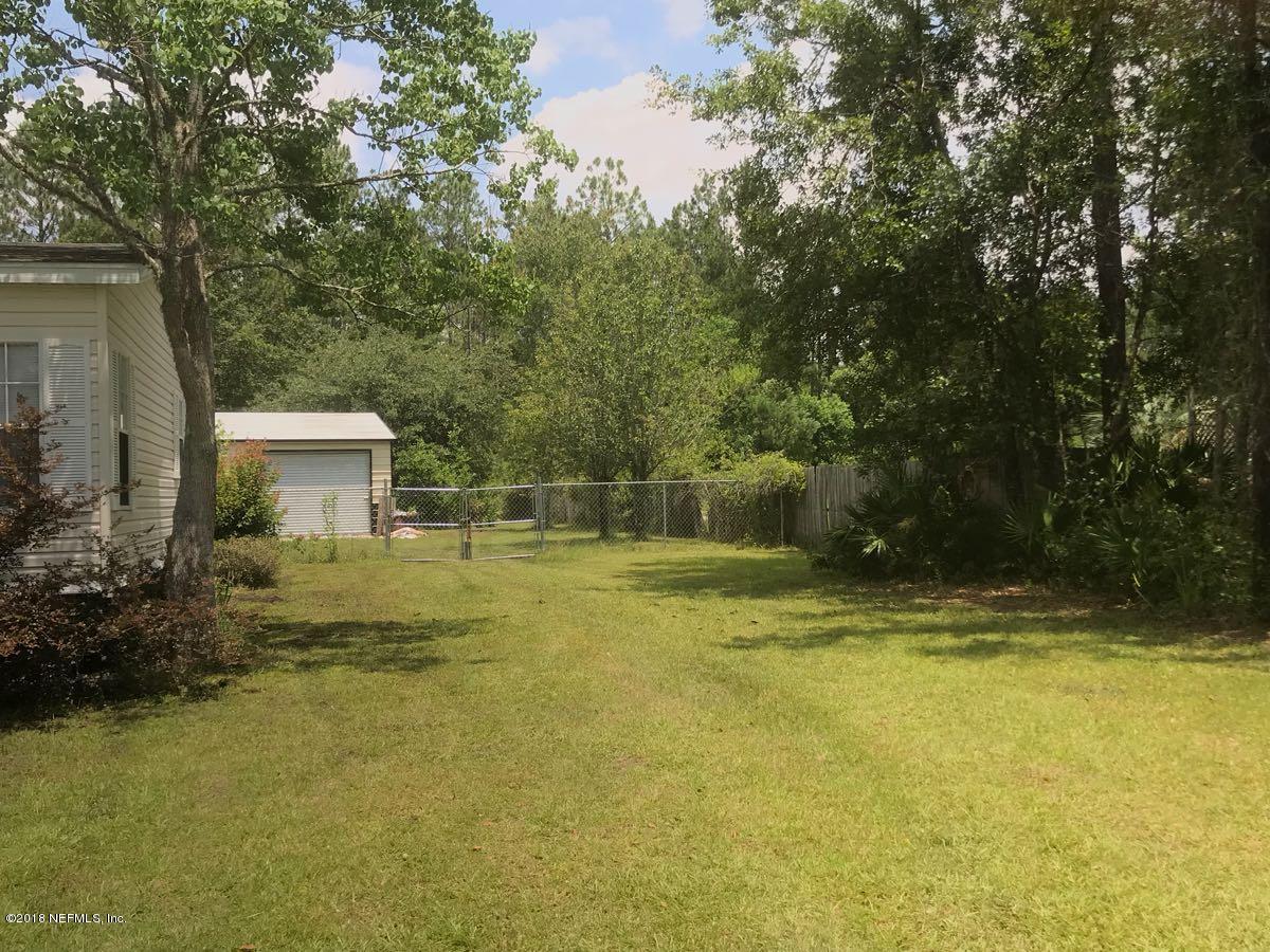 1609 Blair Road Jacksonville, FL 32221 - Photo 29 of 30 a view of a swimming pool with an outdoor space and seating area