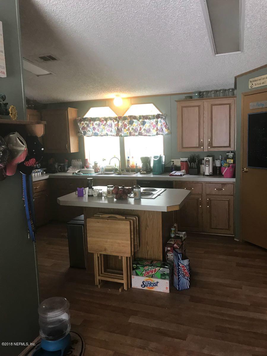 1609 Blair Road Jacksonville, FL 32221 - Photo 7 of 30 a kitchen with a sink cabinets and wooden floor