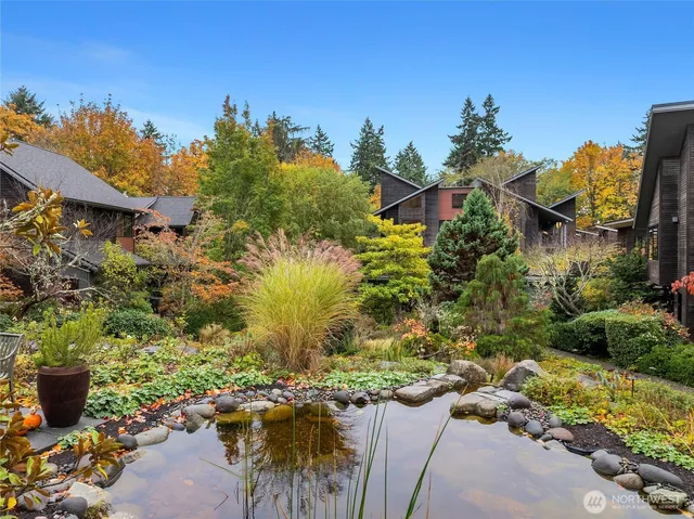 an aerial view of a house with a yard basket ball court and outdoor seating