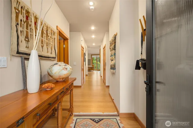 a living room with furniture large window and flat screen tv