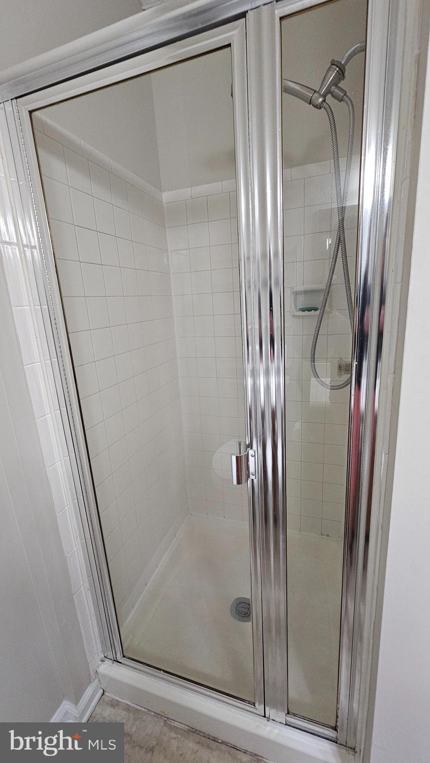 1196 Swanhill Court Chestnut Hill Cove, MD 21226 - Photo 14 of 32 a bathroom with a glass shower door