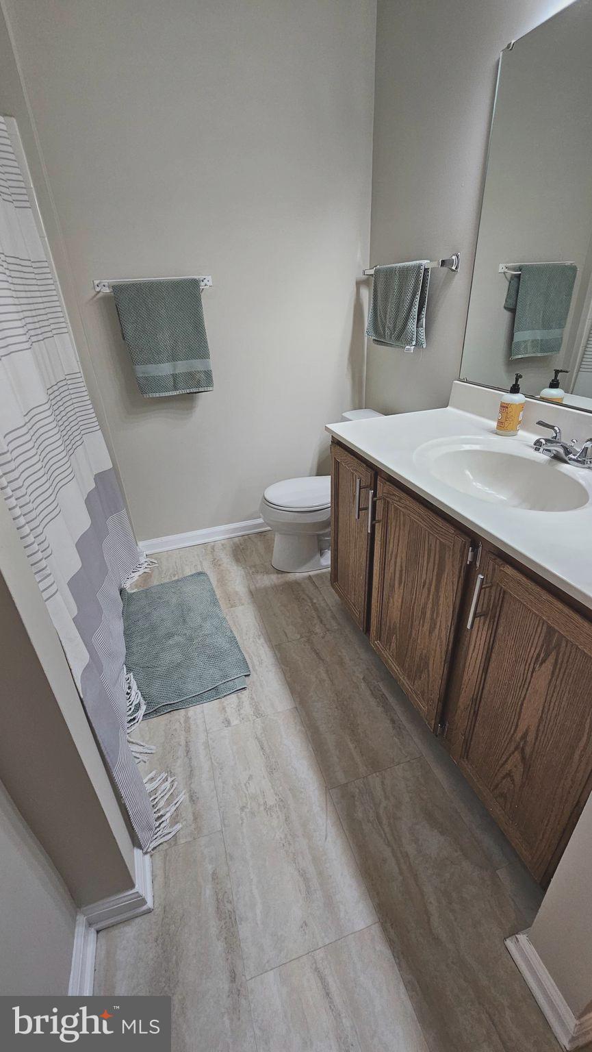 1196 Swanhill Court Chestnut Hill Cove, MD 21226 - Photo 17 of 32 a bathroom with a sink toilet and mirror