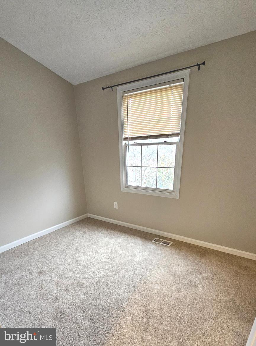 1196 Swanhill Court Chestnut Hill Cove, MD 21226 - Photo 21 of 32 a view of an empty room with a window
