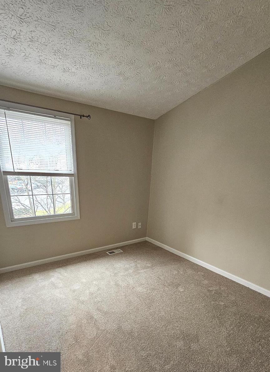 1196 Swanhill Court Chestnut Hill Cove, MD 21226 - Photo 22 of 32 an empty room with a empty space and windows