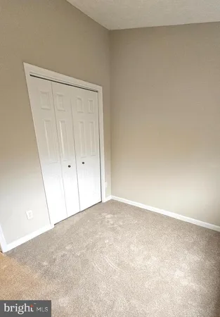 a view of an empty room and entryway