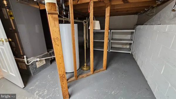 a view of walk in closet with clothes