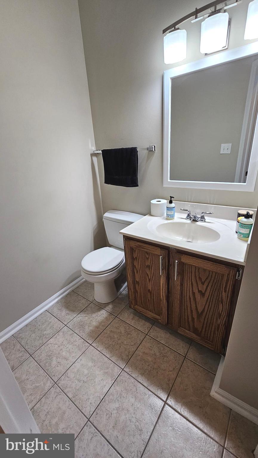 1196 Swanhill Court Chestnut Hill Cove, MD 21226 - Photo 4 of 32 a bathroom with a toilet sink and mirror