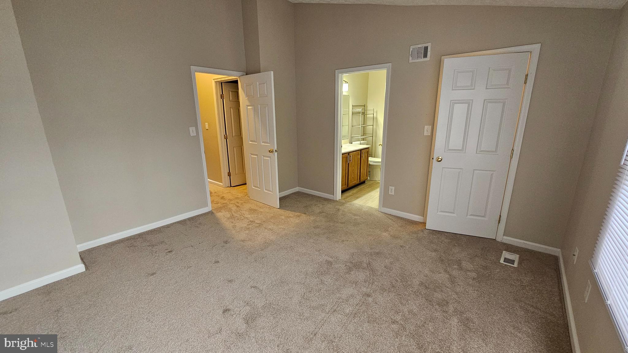1196 Swanhill Court Chestnut Hill Cove, MD 21226 - Photo 10 of 32 an empty room with closet and wooden door