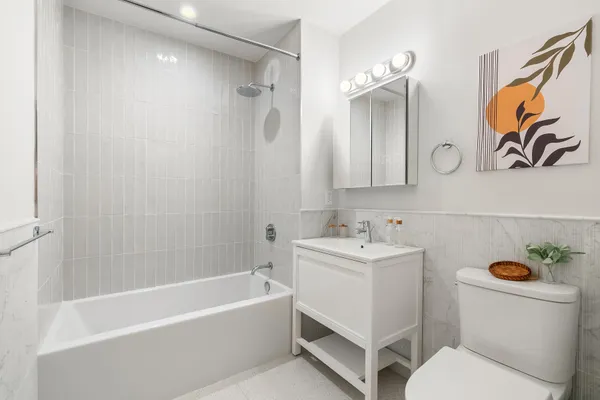 a bathroom with a sink a toilet and a bathtub